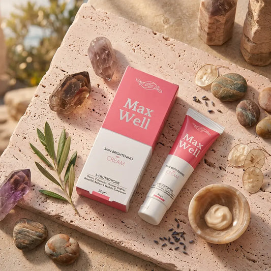 Max Well skin brightening cream by Pellis Health Care packaging and tube on a natural stone surface with crystals and plants.